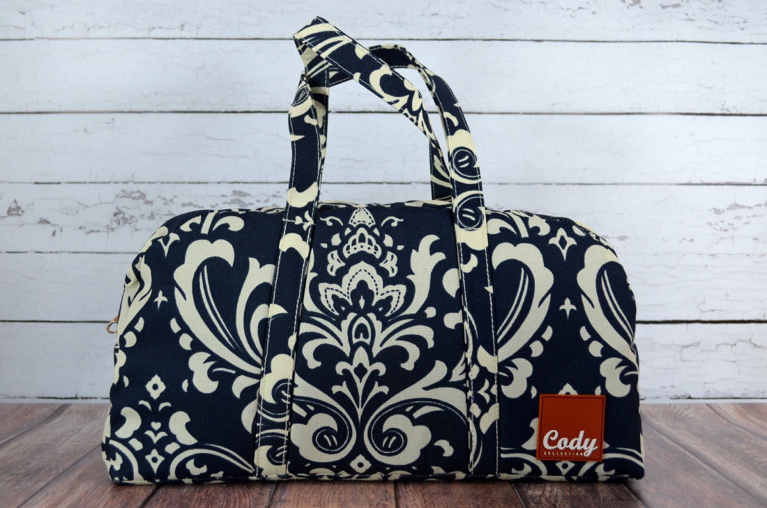  bag with white floral pattern on a wooden